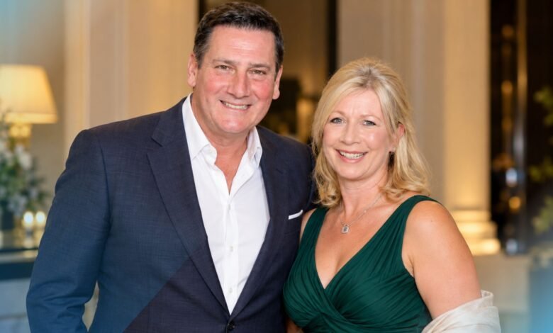 Alison Evers and Tony Hadley posing together at a formal event
