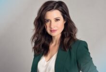 Jennifer Marsala portrait in a forest-green blazer and ivory blouse