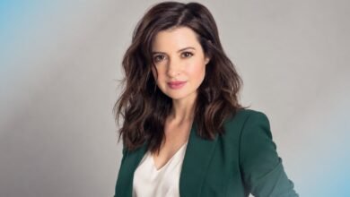 Jennifer Marsala portrait in a forest-green blazer and ivory blouse