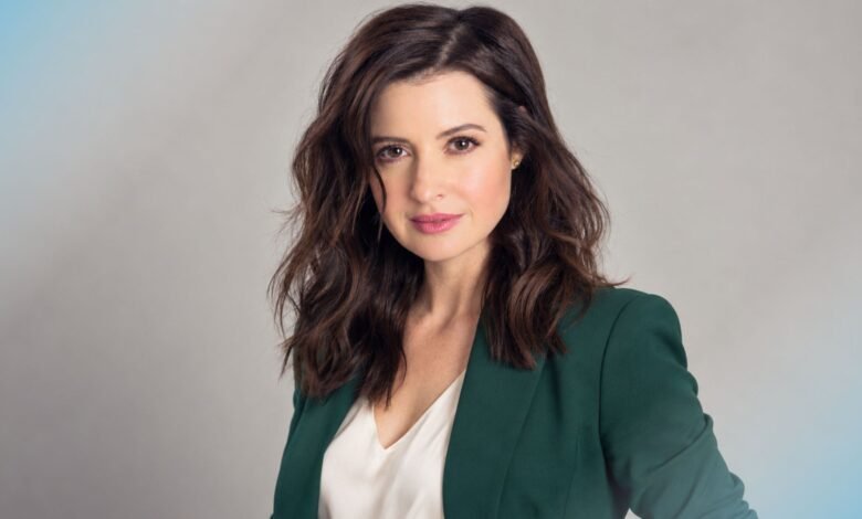 Jennifer Marsala portrait in a forest-green blazer and ivory blouse